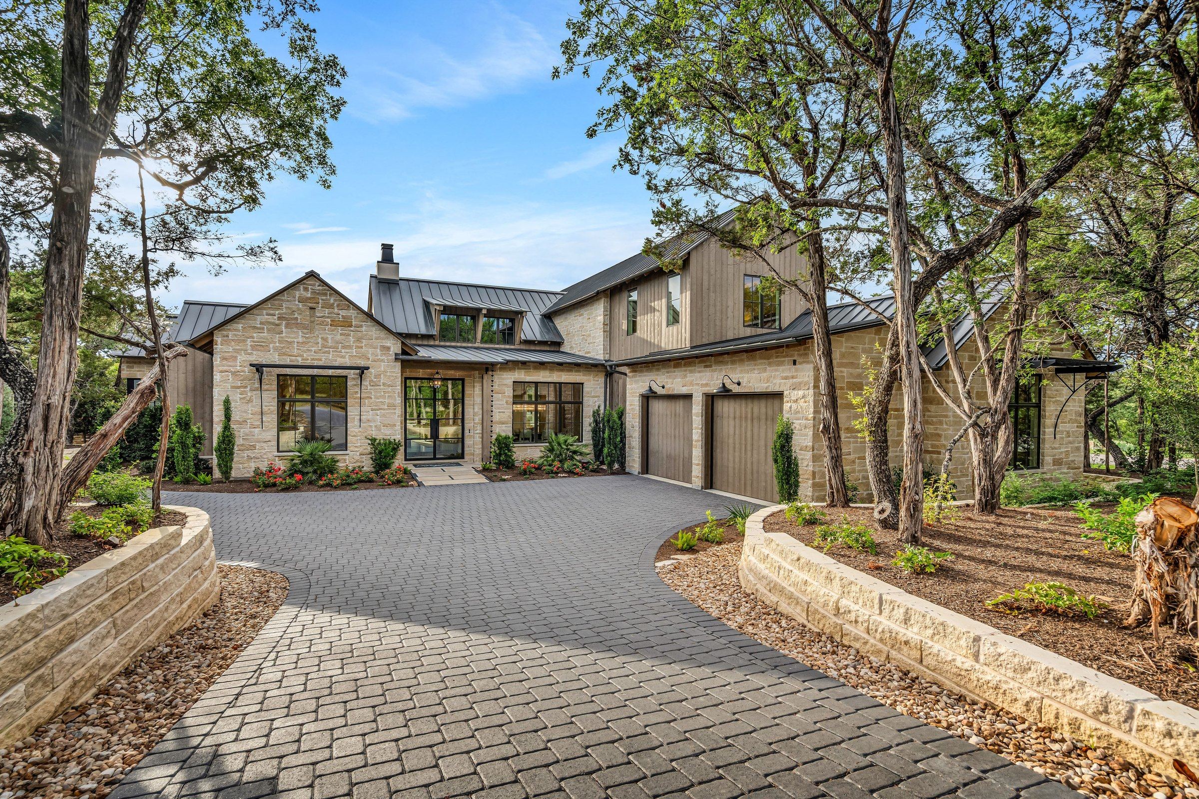 Tree-lined front approach to 4300 Amarra Drive