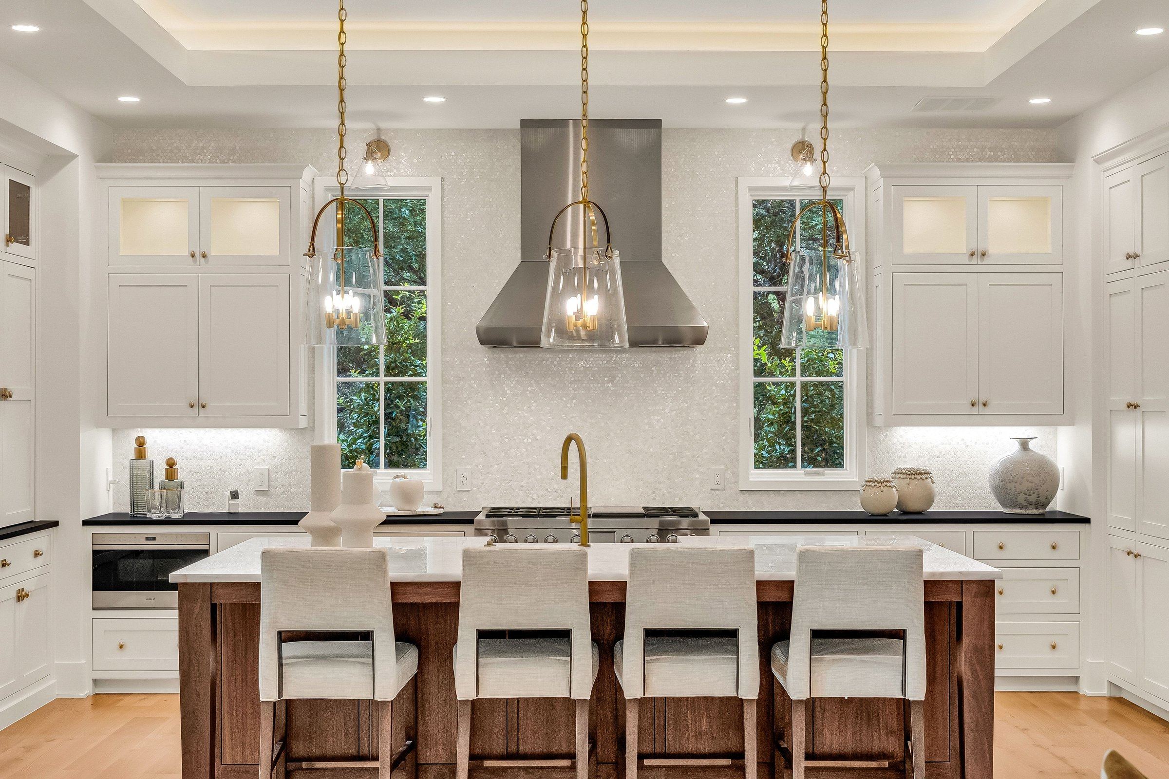 Natural stone and wood kitchen island at 4300 Amarra Drive