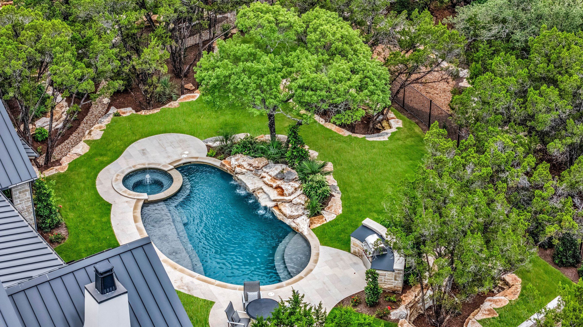 Aerial view of the pool and greenbelt behind 4300 Amarra Drive