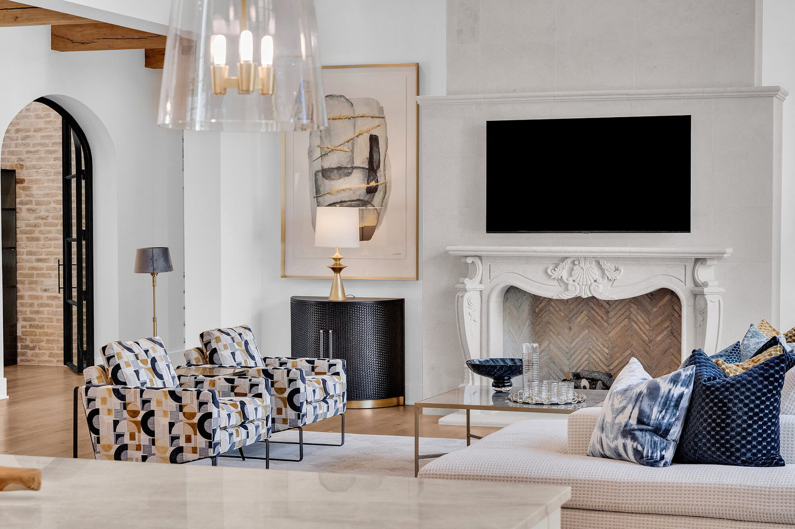 Living room with fireplace inside a Heyl Homes residence at Amarra